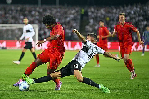DFB-Pokal Ulm vs Bayern Munich: Serge Gnabry, left, and Ulm's Romario Rösch battle for the ball